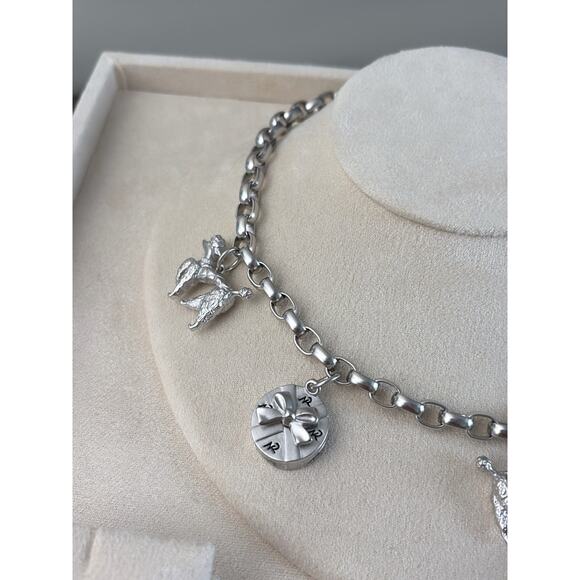 Nina Ricci Silver Necklace with Heart and Flower Charms Nina Ricci Silver Charm Link Necklace